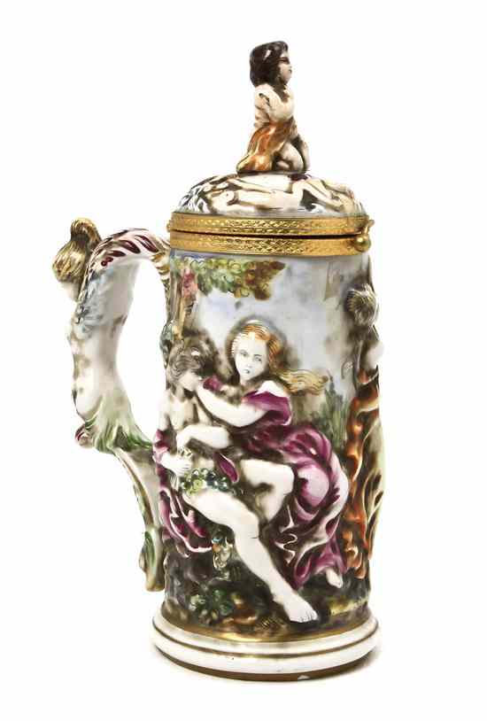 Appraisal: A Capodimonte Tankard having a figural finial handle and relief