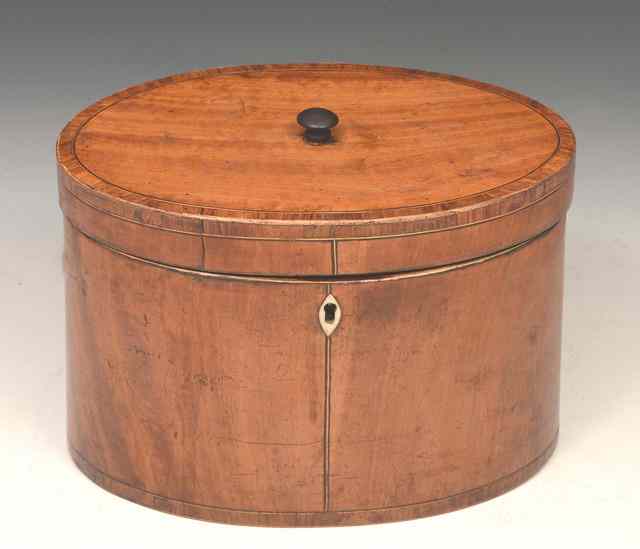 Appraisal: A GEORGIAN OVAL TEA CADDY two divisions plain with stringing