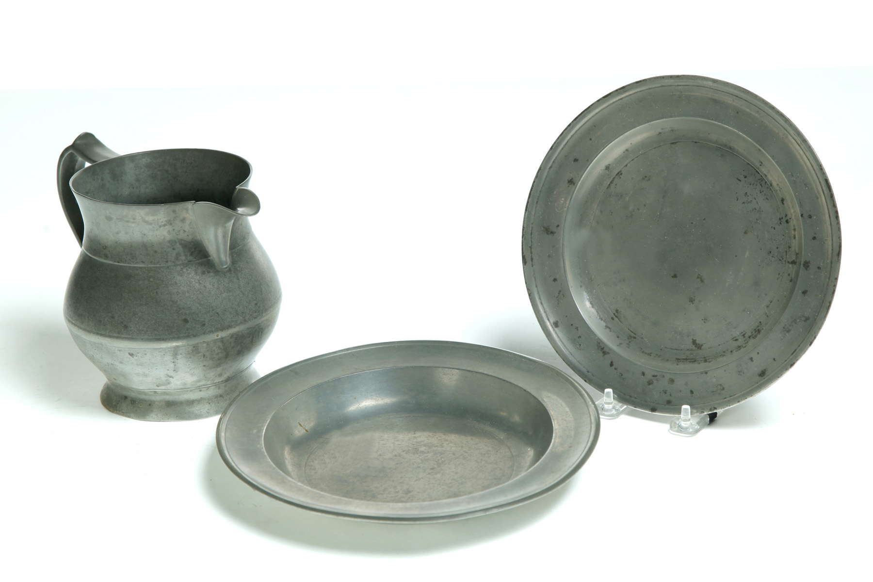 Appraisal: AMERICAN PEWTER PITCHER AND TWO PLATES First half- th century