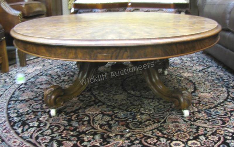 Appraisal: An antique style burlwood cocktail table oval with carved legs