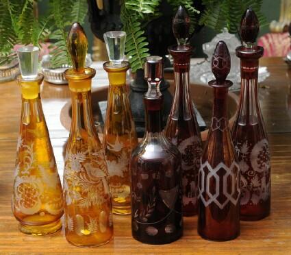 Appraisal: SEVEN BOHEMIAN RUBY FLASHED AND AMBER FLASHED GLASS DECANTERS Each