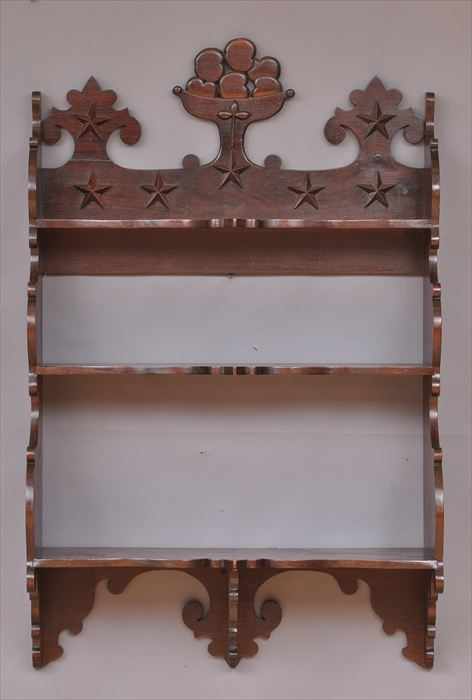 Appraisal: VICTORIAN CARVED WALNUT HANGING SHELF The shaped top rail with