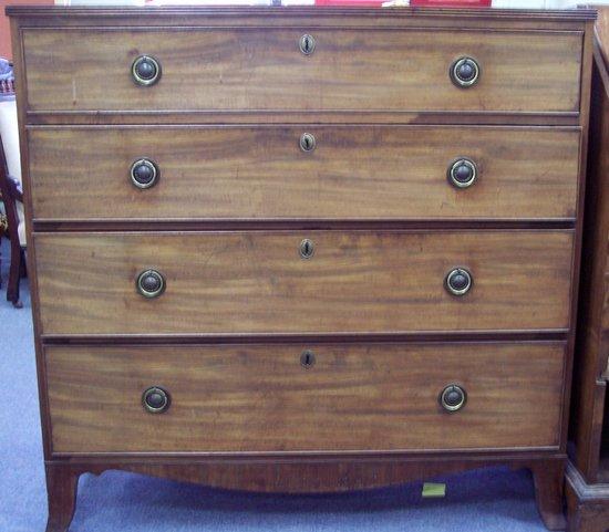 Appraisal: A George III mahogany chest of four long drawers on