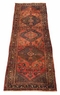 Appraisal: A Hamadan Carpet Three medallion in blue on soft rose