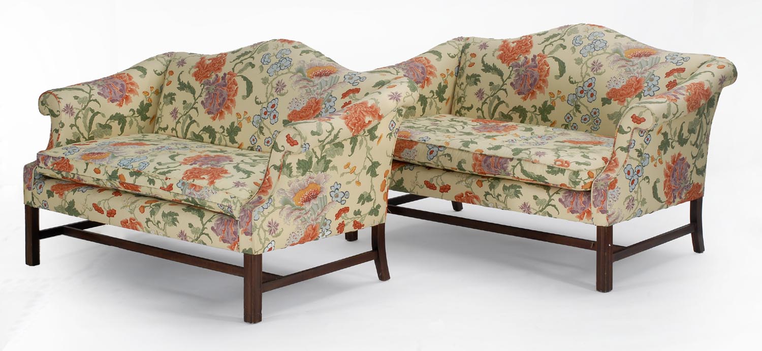 Appraisal: PAIR OF CHIPPENDALE-STYLE CAMELBACK LOVE SEATS with yellow floral upholstery