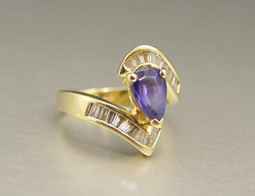 Appraisal: TANZANITE AND DIAMOND RING K yellow gold The ring contains