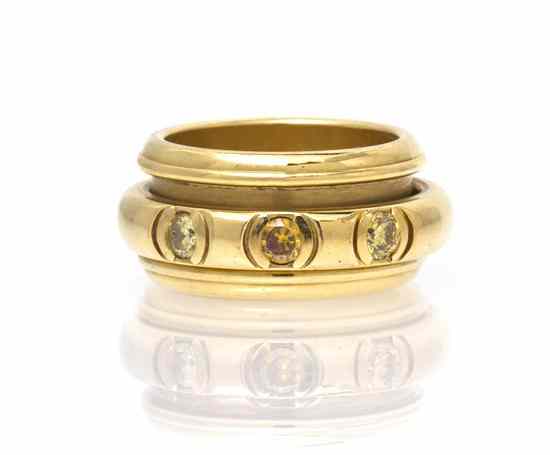 Appraisal: An Karat Yellow Gold and Colored Diamond Rolling Ring Piaget