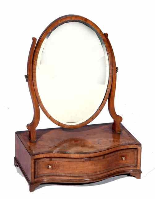 Appraisal: A GEORGE III MAHOGANY SERPENTINE DRESSING TABLE MIRROR the base