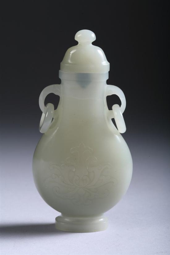 Appraisal: CHINESE CELADON JADE VASE AND COVER Flattened ovoid-form carved to