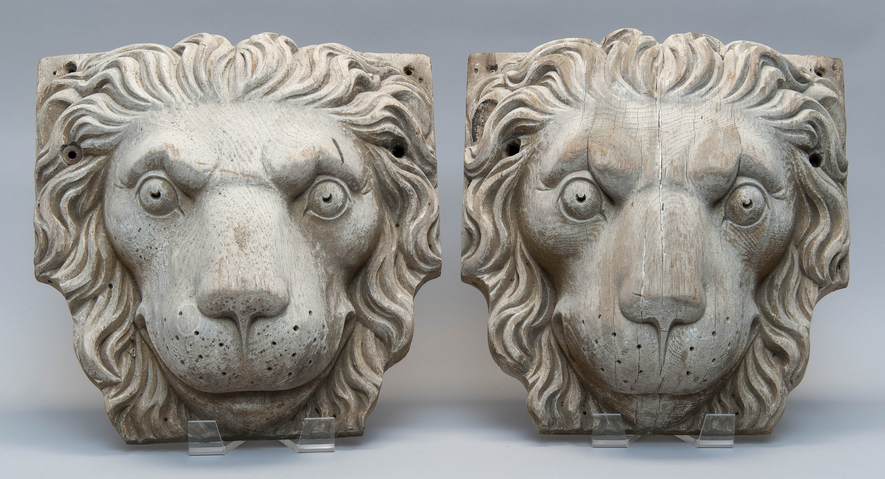 Appraisal: PAIR OF CARVED WOOD ARCHITECTURAL MOLDINGS OF LION'S HEADS Late