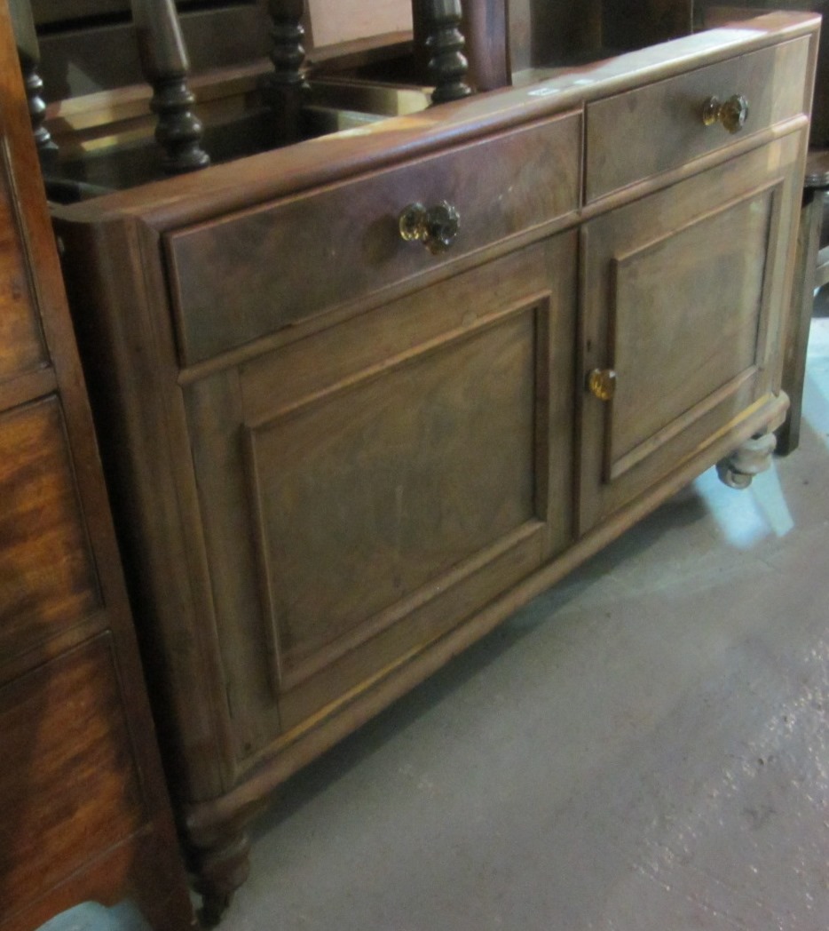 Appraisal: A th century mahogany side cabinet with a pair of