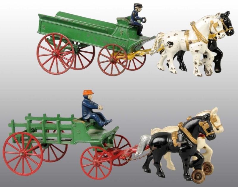 Appraisal: Lot of Cast Iron Kenton Wagon Toys Description Circa s