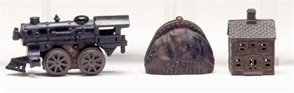 Appraisal: Two cast iron banks and cast iron train engine toy