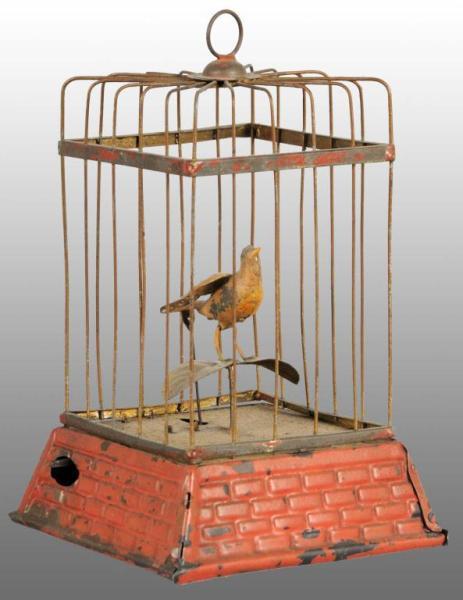 Appraisal: Tin Hand-Painted Birdcage Wind-Up Toy Description German Working Base is