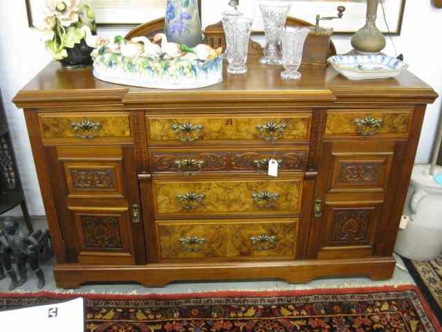 Appraisal: Fine Carved Mahogany Server burl drawer decoration carved doors splashback