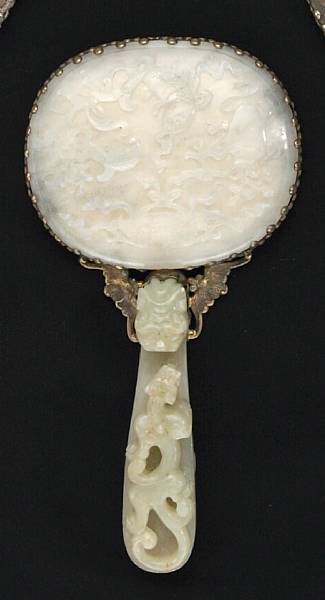 Appraisal: A jade-mounted silver and glass hand mirror The mirror back