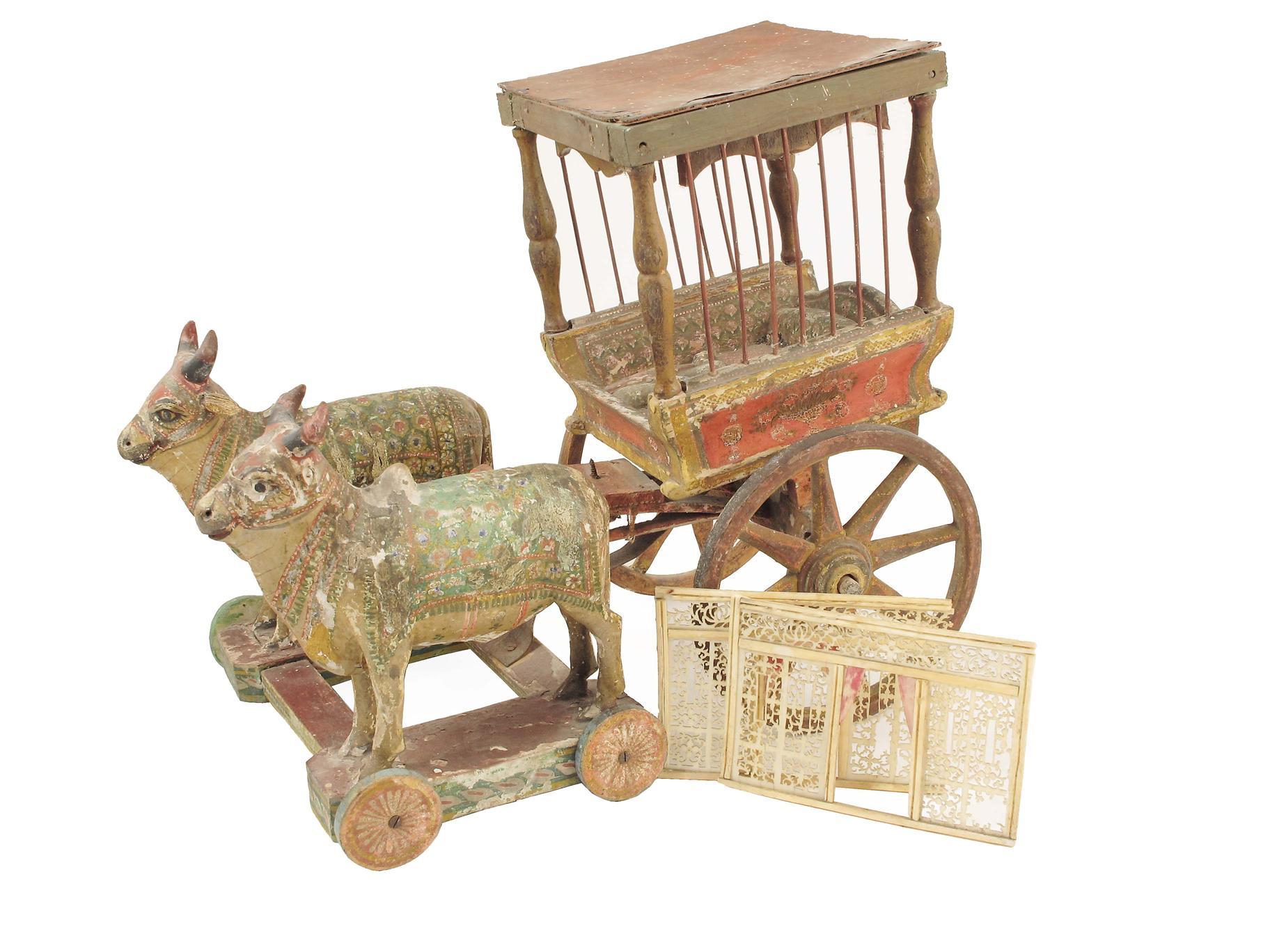 Appraisal: An Indian polychrome decorated wood ox drawn carriage group