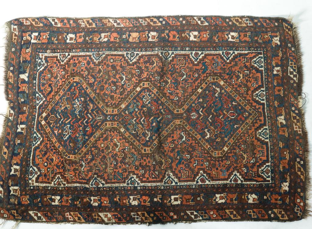 Appraisal: ANTIQUE SOUTH-WEST PERSIAN RUG c three medallions against a terracotta