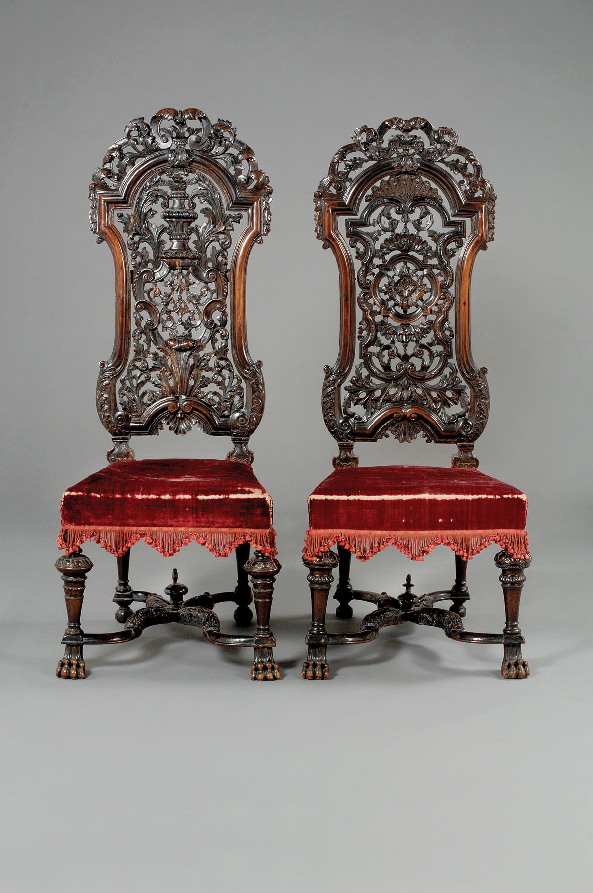 Appraisal: PAIR OF JAMES II HIGHLY CARVED WALNUT SIDE CHAIRS IN