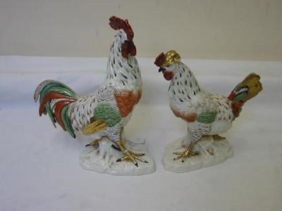 Appraisal: A PAIR OF CONTINENTAL PORCELAIN FIGURES OF A COCKEREL AND