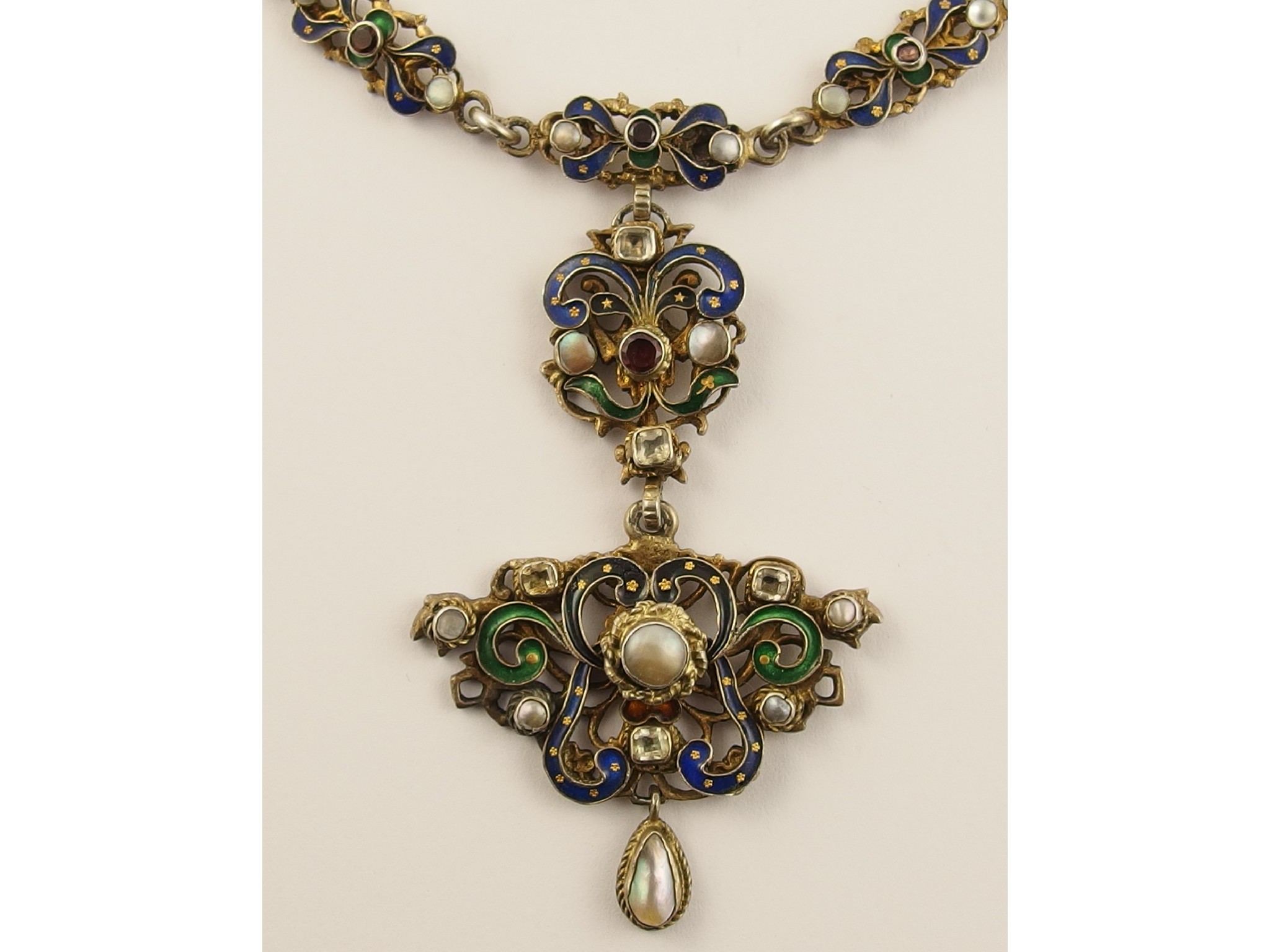 Appraisal: An Austro Hungarian enamel and gem set necklacein gilded white