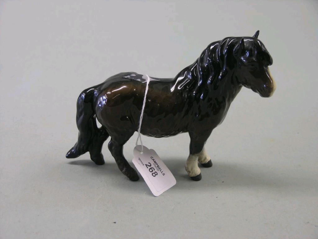 Appraisal: A Beswick Shetland pony two-tone brown