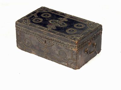 Appraisal: An th century brass studded and leather box with a