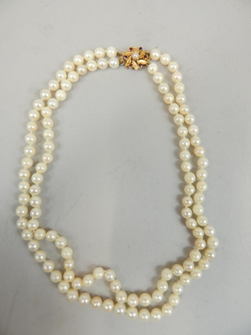 Appraisal: A double strand cultured pearl necklace with a ct gold