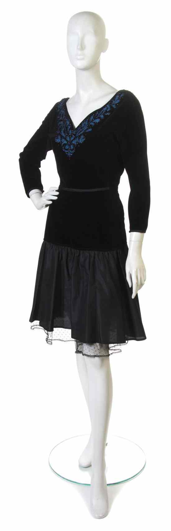 Appraisal: A Gianni Versace Black Velvet Dress with a taffeta skirt