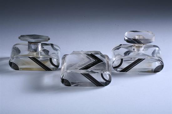 Appraisal: THREE ART DECO BLACK ENAMEL AND FROSTED GLASS DRESSER BOTTLES