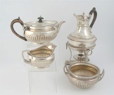 Appraisal: A George III four piece tea service with part-fluted circular