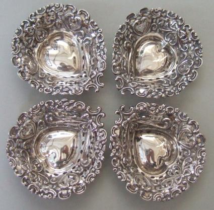 Appraisal: A set of four silver heart shaped bonbon dishes with