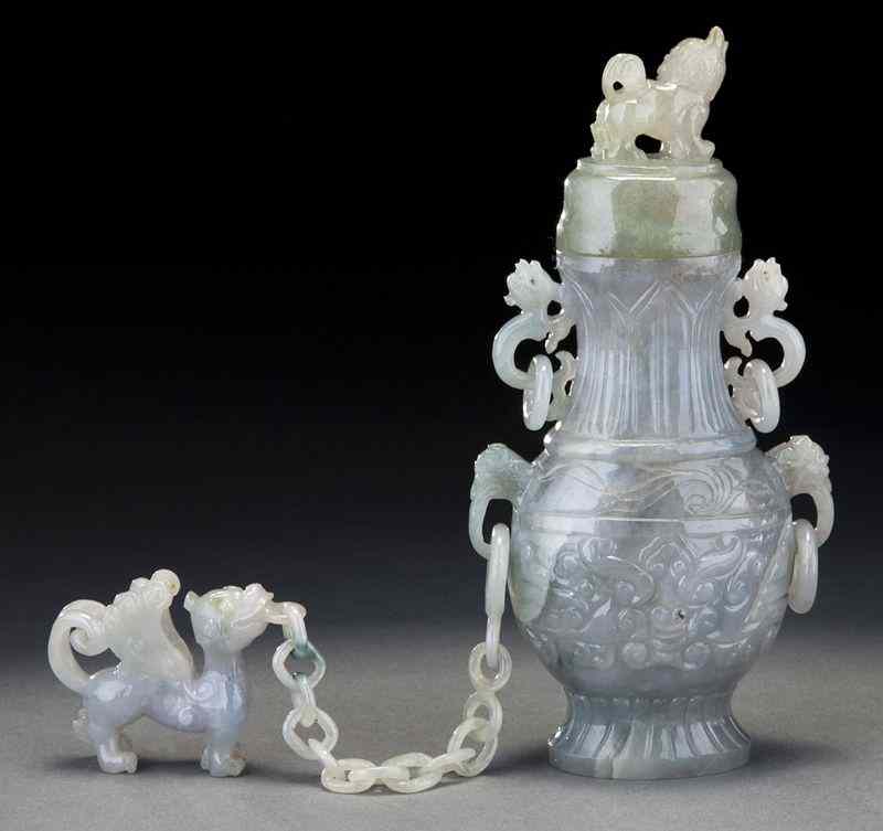 Appraisal: Chinese carved jadeite vasewith a unicorn finial the body with