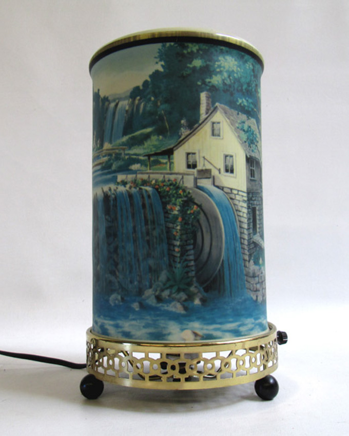 Appraisal: DECORATIVE TABLE LAMP cylindrical vinyl shade having waterfall scene and