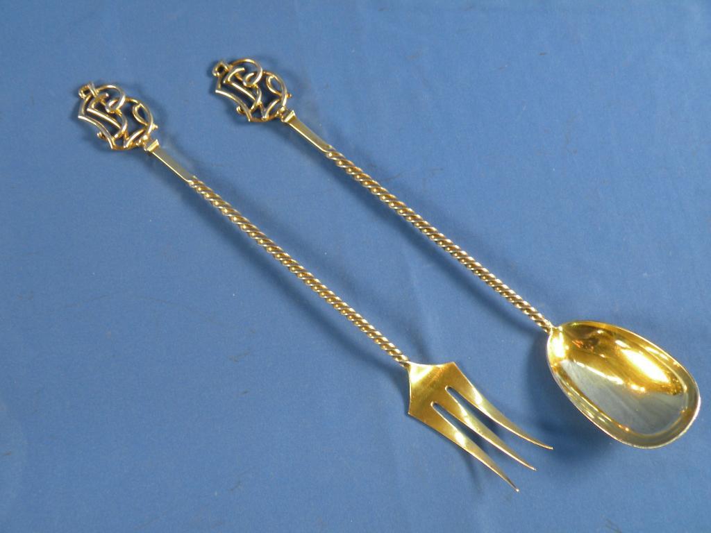 Appraisal: A pair of silver gilt salad spoons each with a