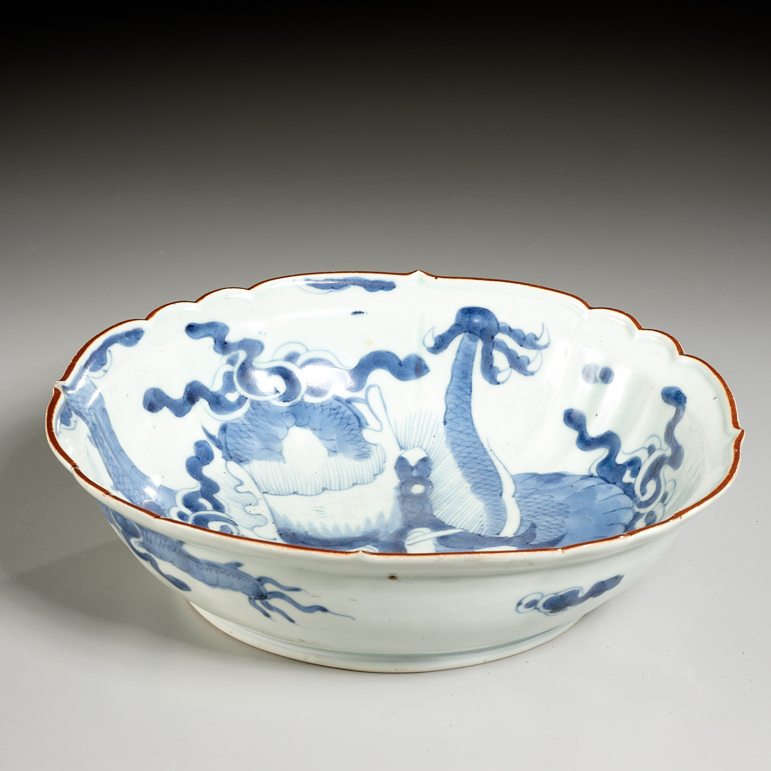 Appraisal: ASIAN BLUE WHITE PORCELAIN DRAGON BOWL th th c possibly