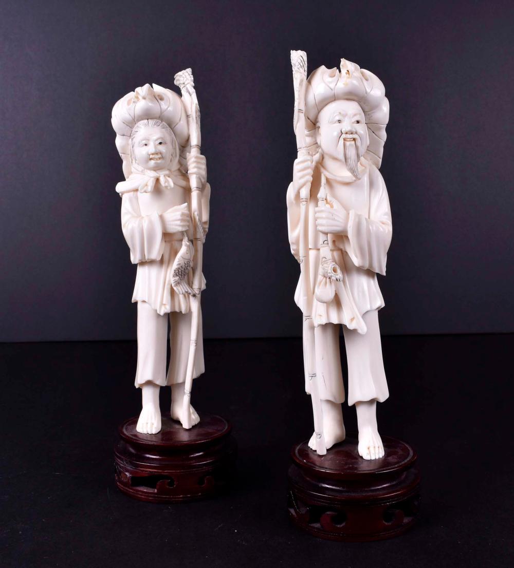 Appraisal: PAIR OF CHINESE CARVED MALE FEMALE FIGURESEach wearing a cloth