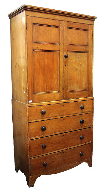 Appraisal: A VICTORIAN PINE LINEN PRESS with two panelled doors above