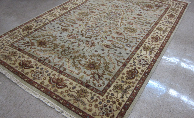 Appraisal: HAND KNOTTED ORIENTAL CARPET Indo-Persian overall floral tracery pattern on