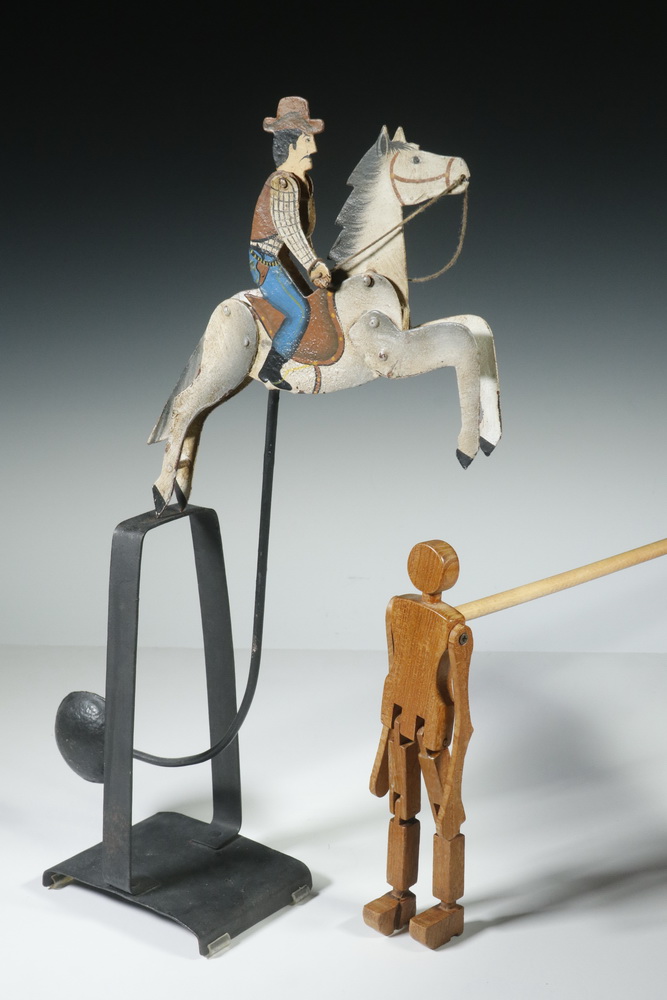 Appraisal: DECORATIVE WHIMSEYS Counter balanced rocking horse with rider Painted metal