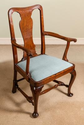 Appraisal: A George II walnut splat back armchair on cabriole legs