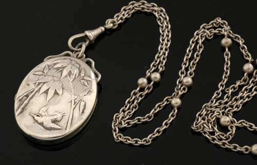 Appraisal: CONTINENTAL SILVER LOCKET AND MUFF CHAIN