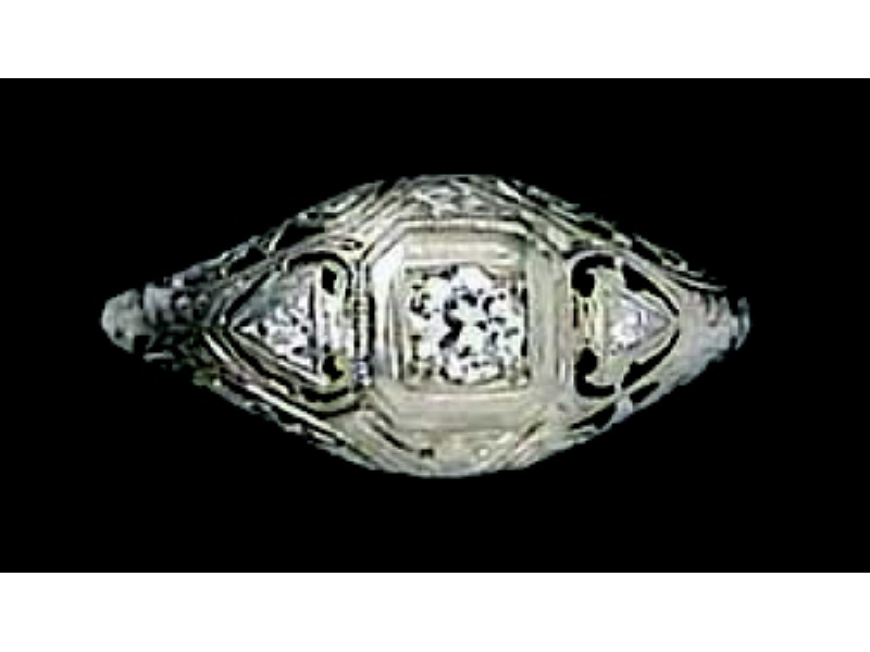 Appraisal: FILIGREE DIAMOND RING White gold lady's ring set with one