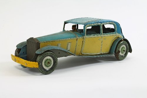 Appraisal: An English clockwork tinplate car blue and cream painted with