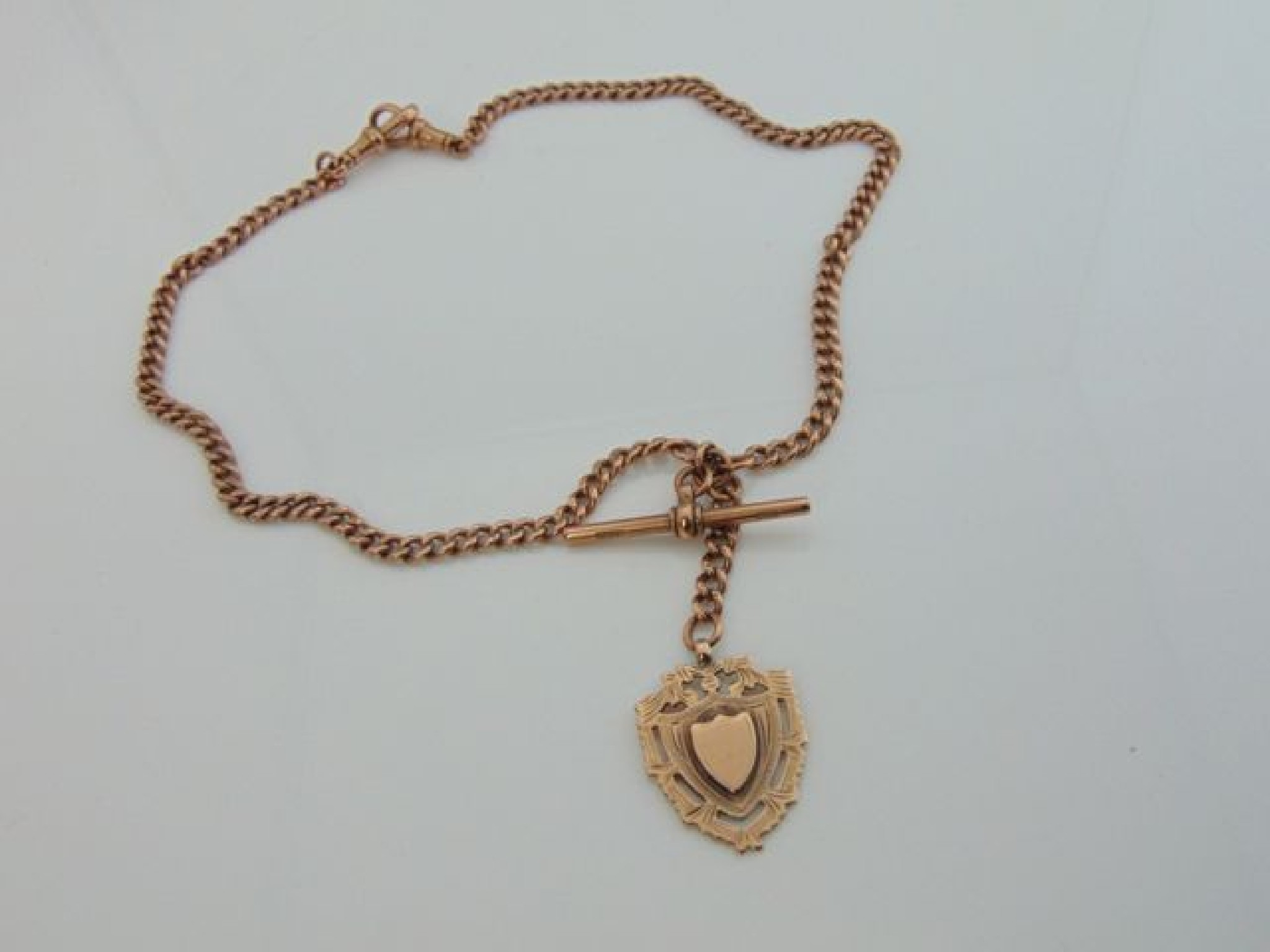 Appraisal: A ct rose gold watch chain with toggle and medallion