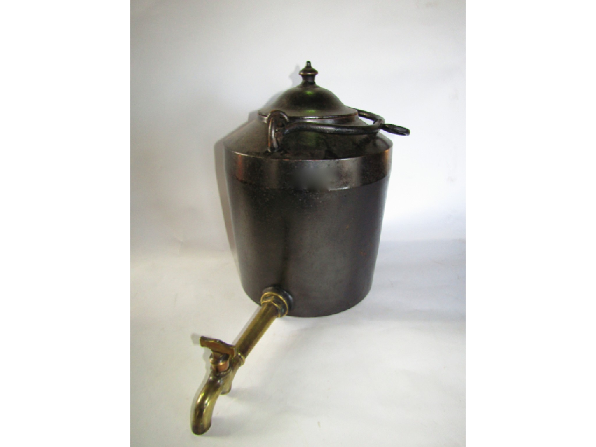 Appraisal: A substantial good quality cast iron hopper kettle with an