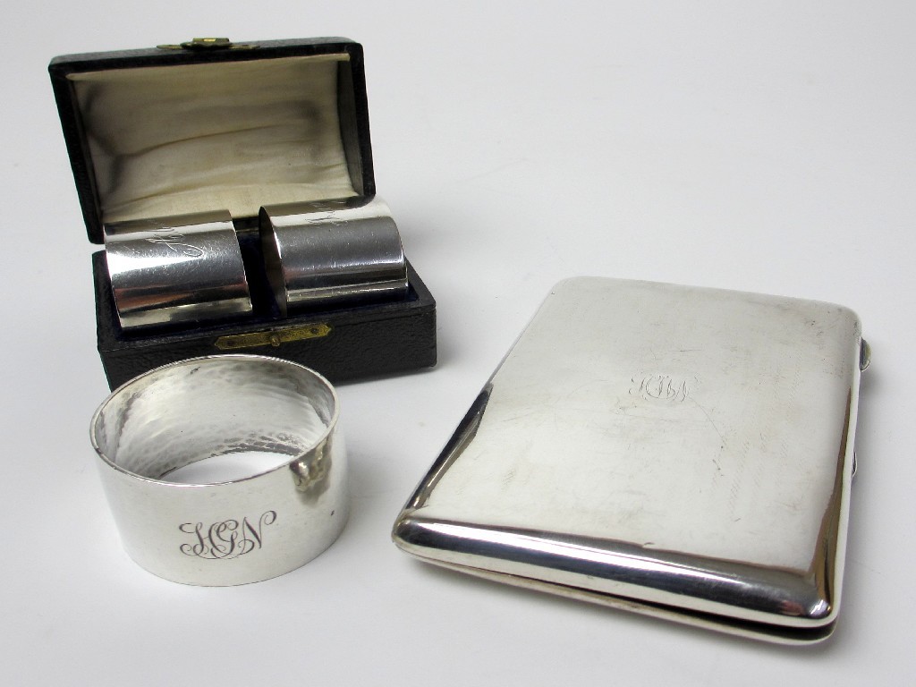 Appraisal: A cased pair of silver napkin rings Birmingham a single