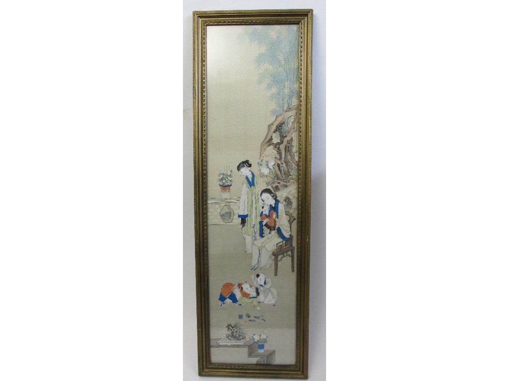 Appraisal: A Chinese silk painted panel with a family scene on