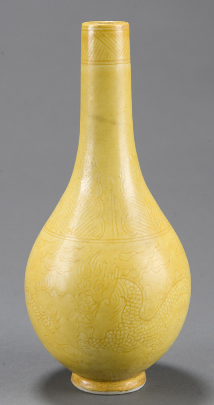 Appraisal: Chinese yellow glazed bottle-form porcelain vase th century Lightly carved