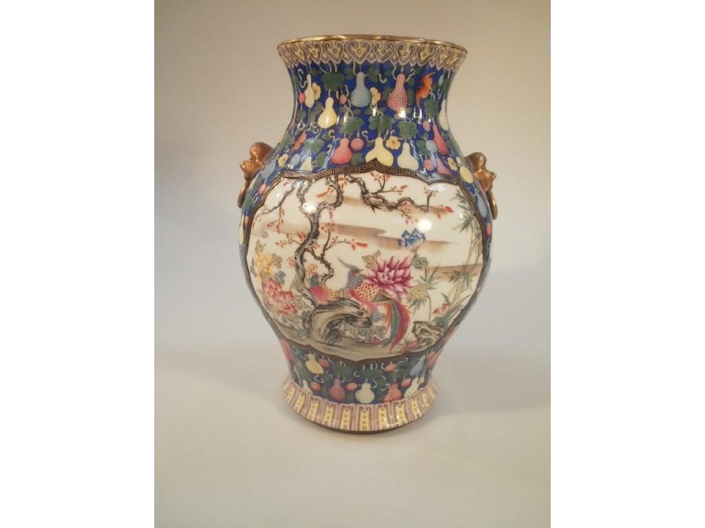 Appraisal: A large Chinese porcelain blue ground baluster vase decorated with